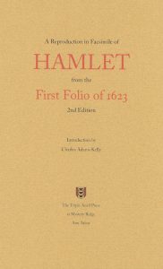 Image of the front cover of A Reproduction in Facsimile of Hamlet from the First Folio of 1623. It is a light brown cover with red and black lettering and includes the logo for the Triple Anvil Press, a red shield with three black anvils stacked vertically. 